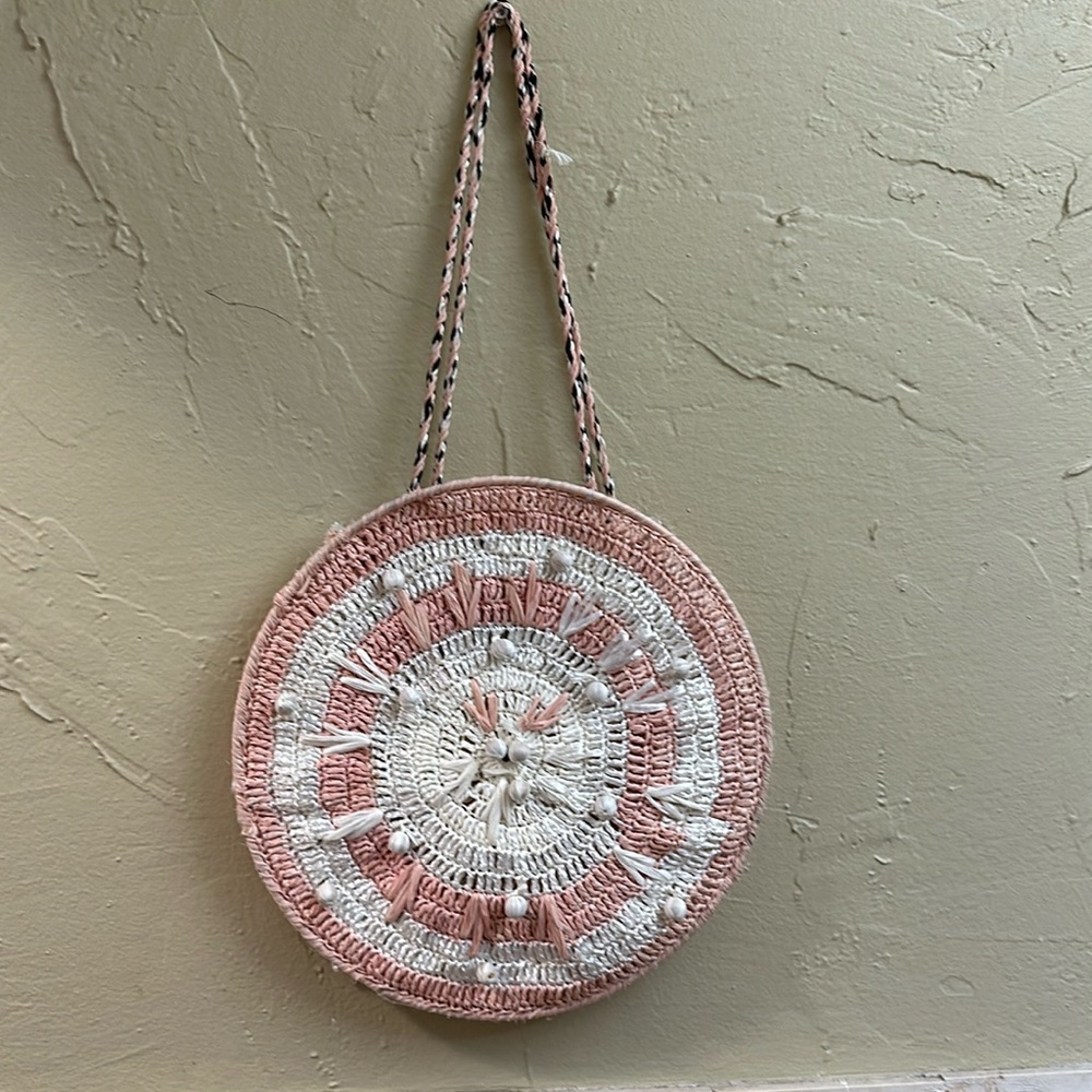 Cleobella round pink and white pom-pom bag